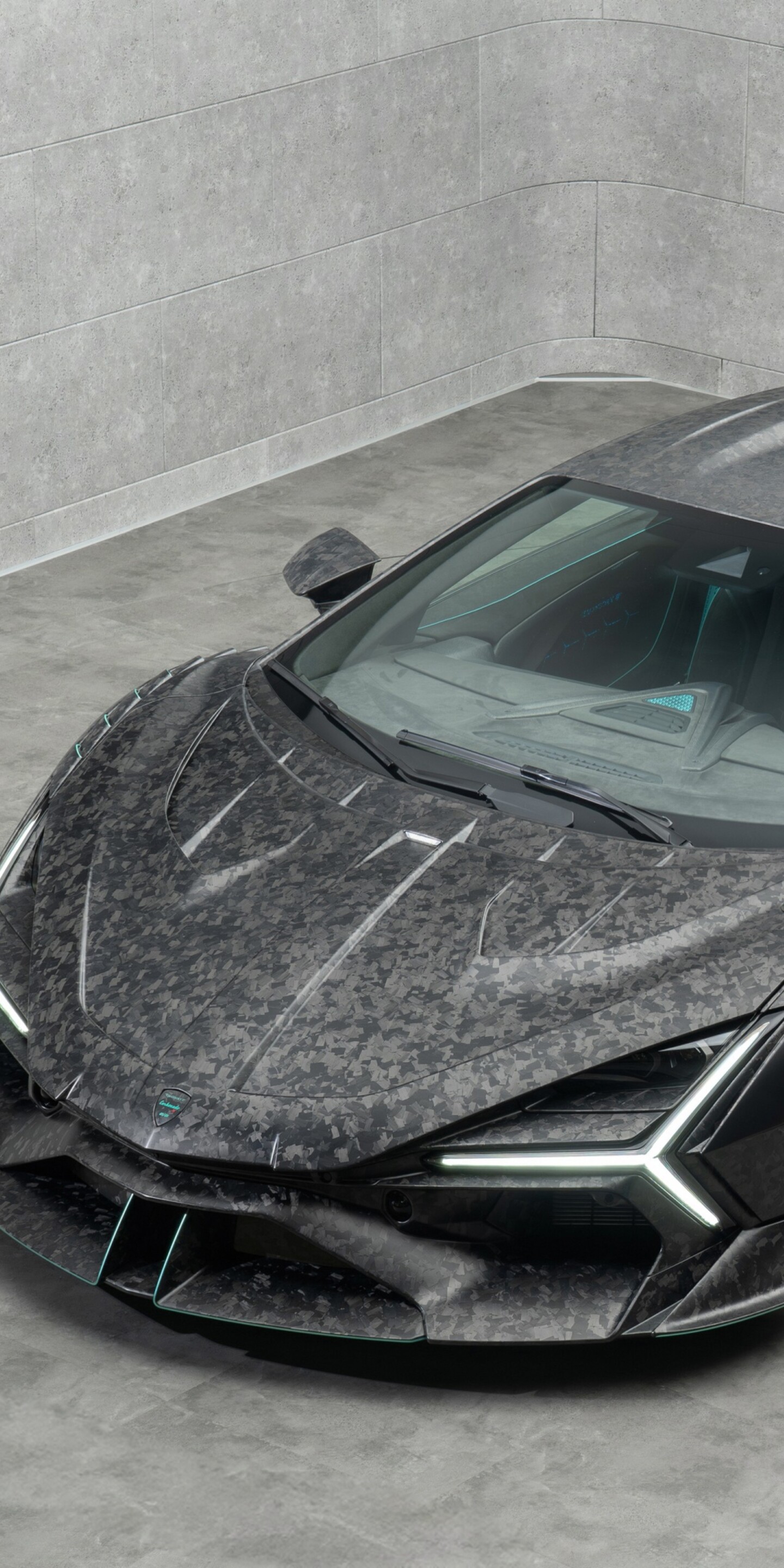 A detailed close-up of a Lamborghini Revuelto featuring premium carbon fiber textures and sleek aerodynamic lines.