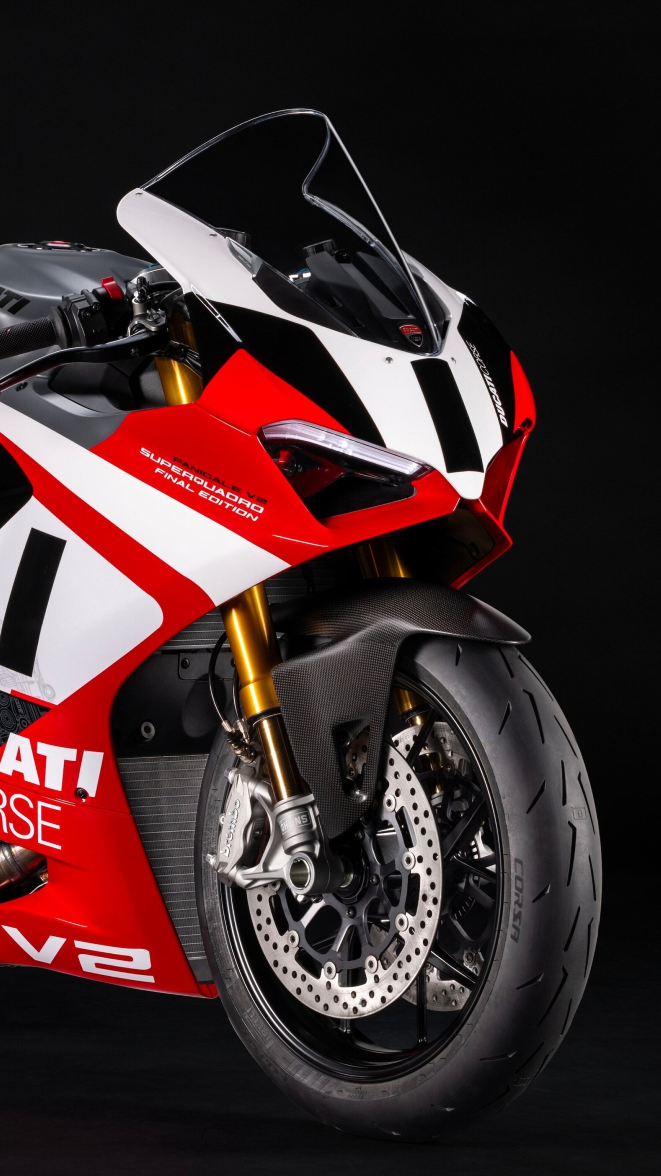 A detailed, cinematic shot of a Ducati Panigale V2 superbike against a dark, minimalist background.