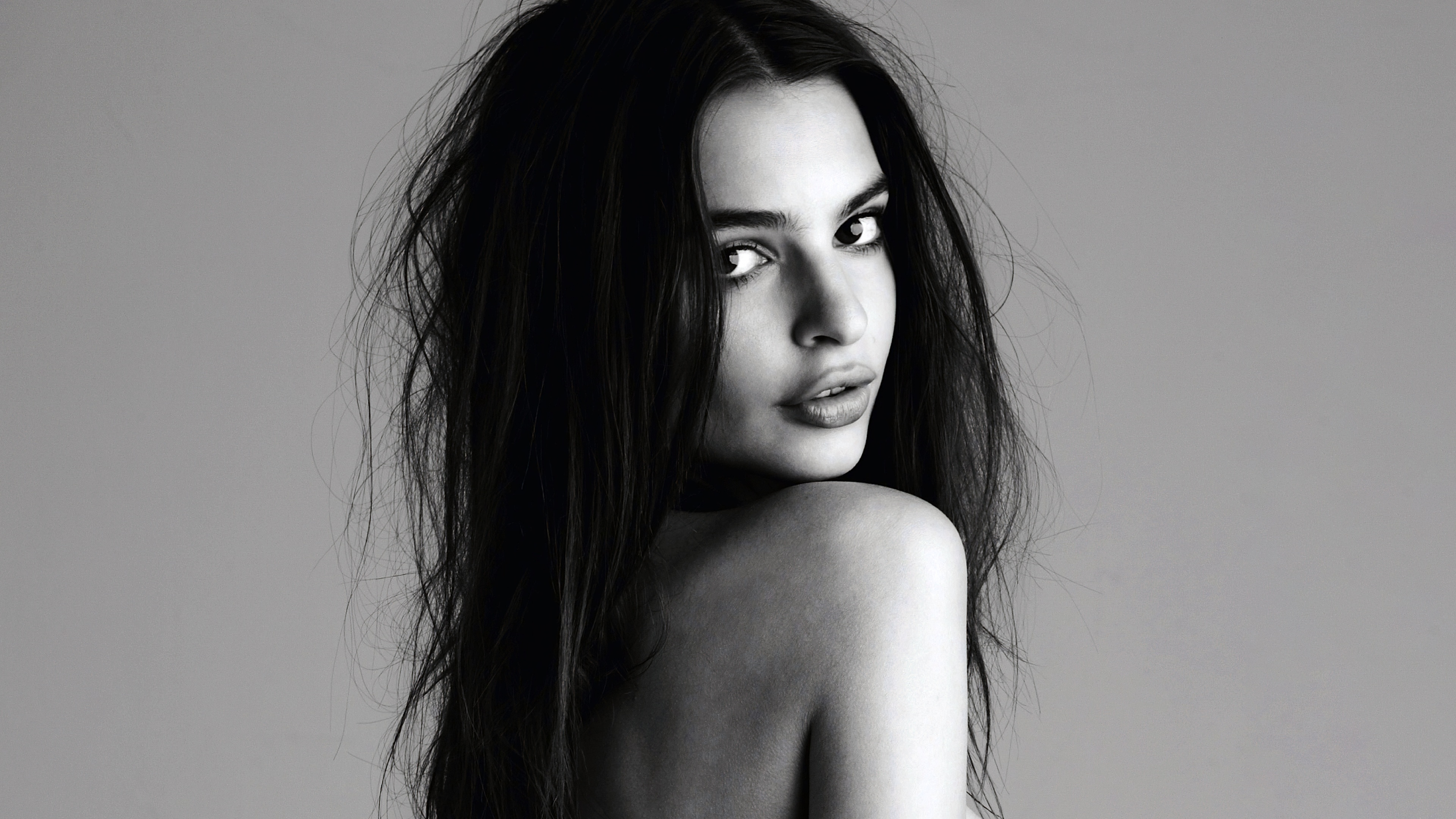 A high-detail black and white monochrome portrait of American model Emily Ratajkowski.