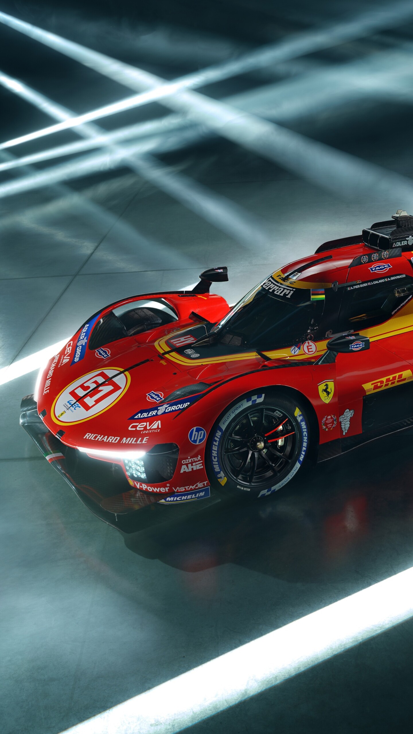 A cinematic, high-resolution view of the Ferrari 499P Le Mans Hypercar featuring dramatic lighting and intricate aerodynamic details.