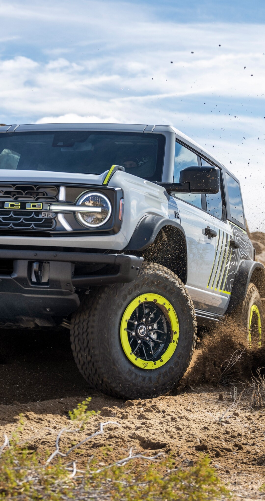 A sleek and rugged futuristic off-road SUV designed for 2027, featuring advanced all-terrain capabilities.