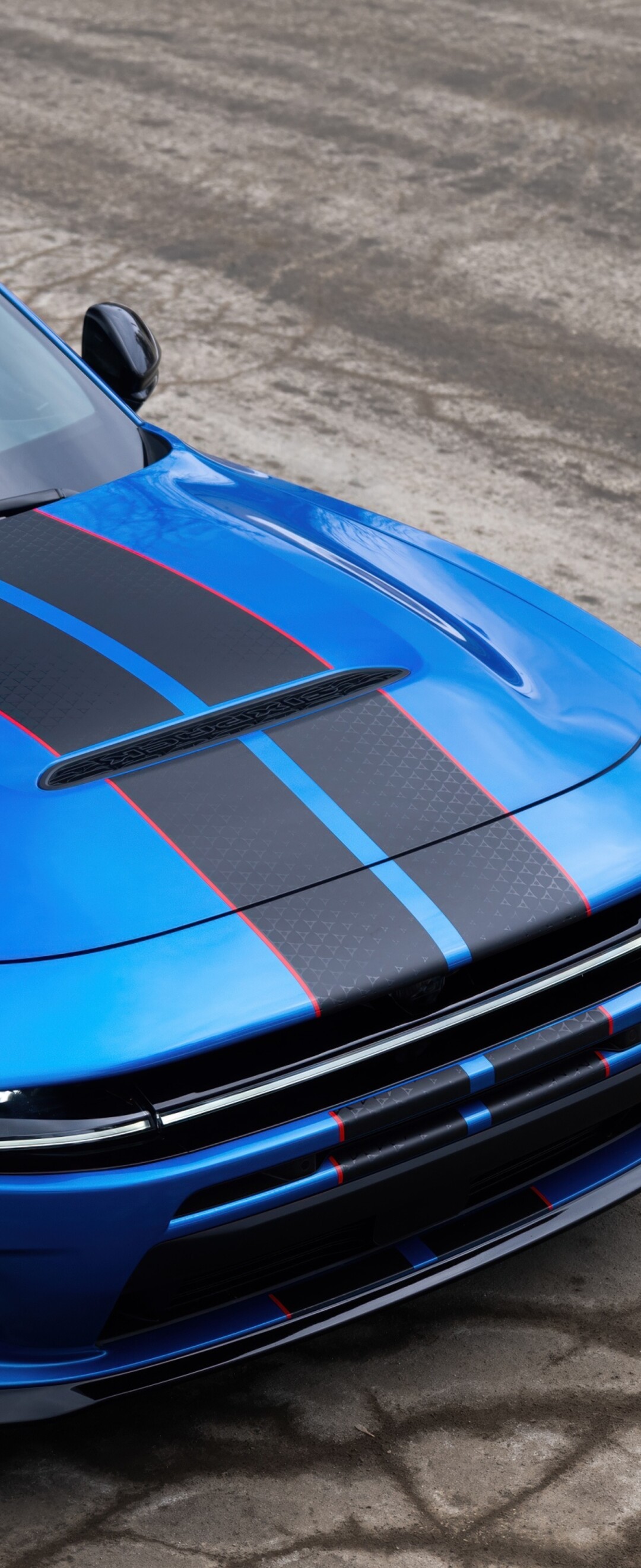 A sleek and aerodynamic blue concept car featuring futuristic 2026 design elements.