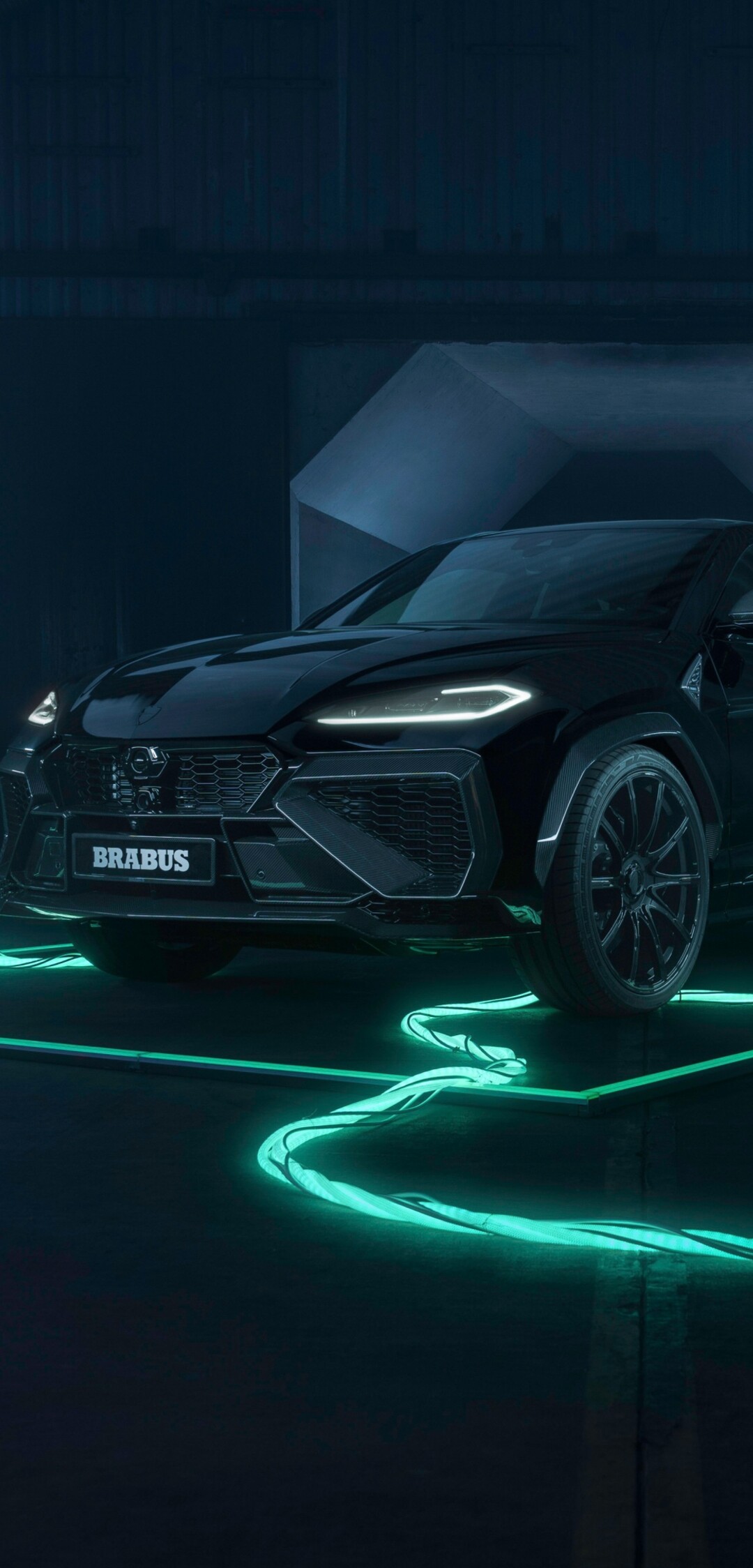 High-detail shot of a black Brabus 900 Superblack and a Lamborghini Urus SE featuring neon lights and a dark futuristic aesthetic.