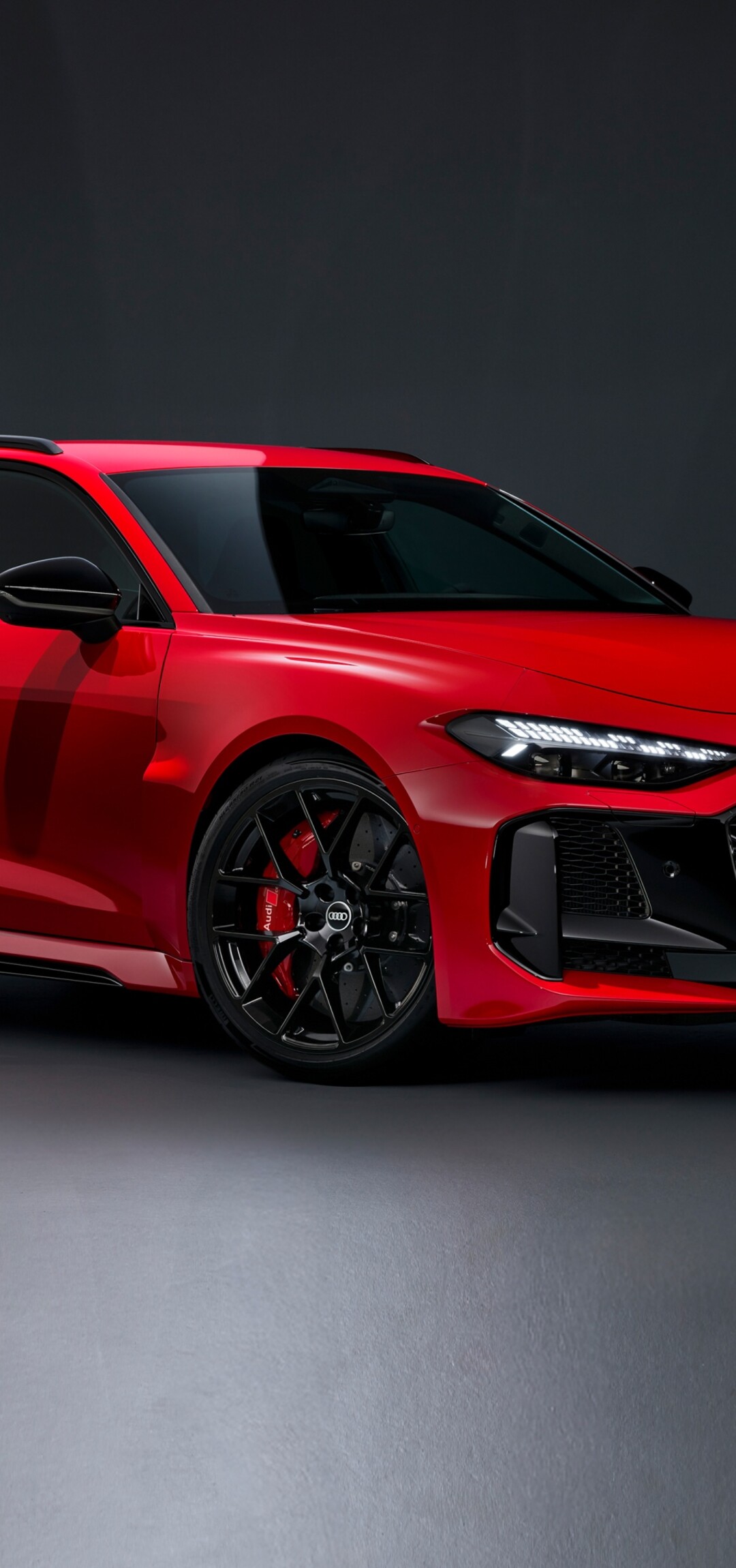A fleet of polished, vibrant red futuristic cars driving through a high-tech cityscape.