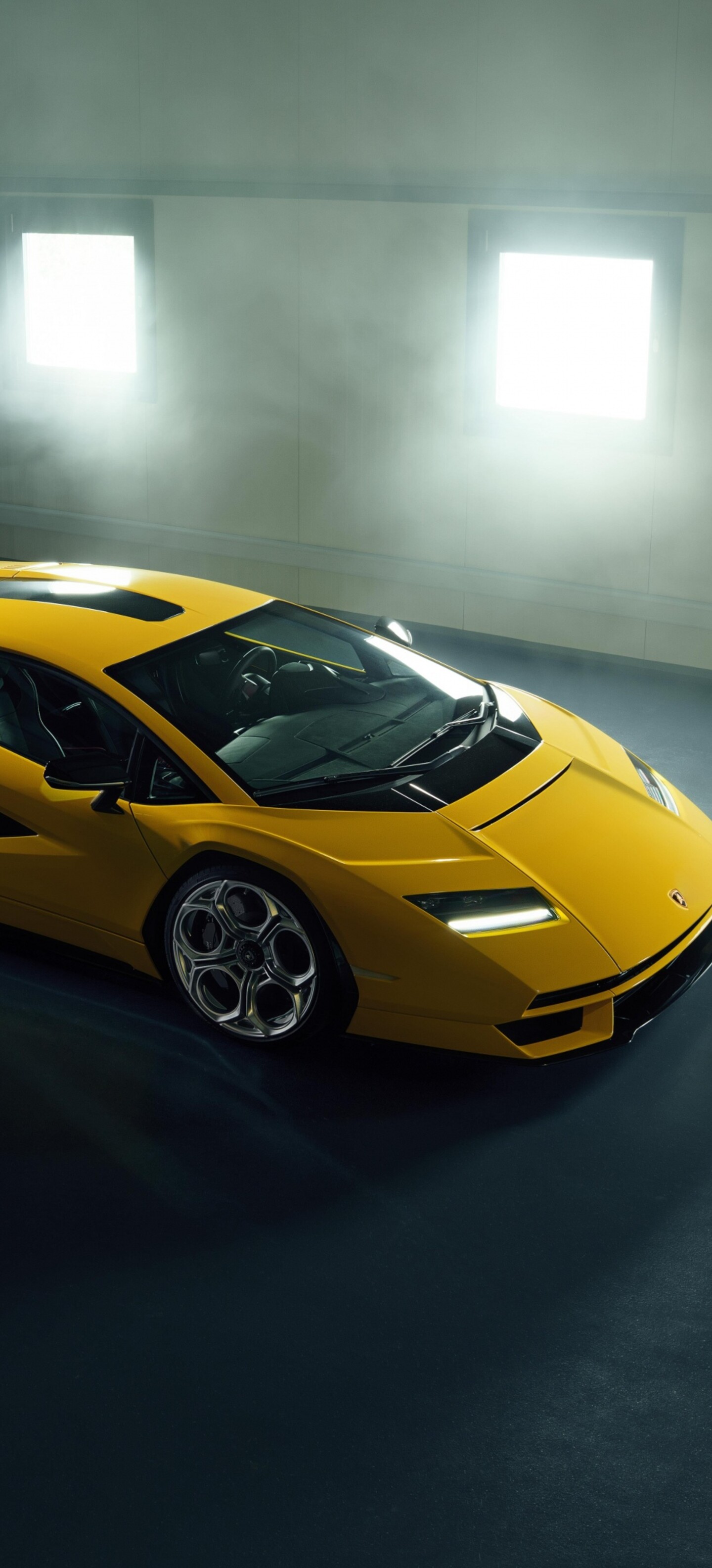 A high-detail, cinematic shot of a Lamborghini Countach LPI 800-4 parked inside a modern, luxury garage.