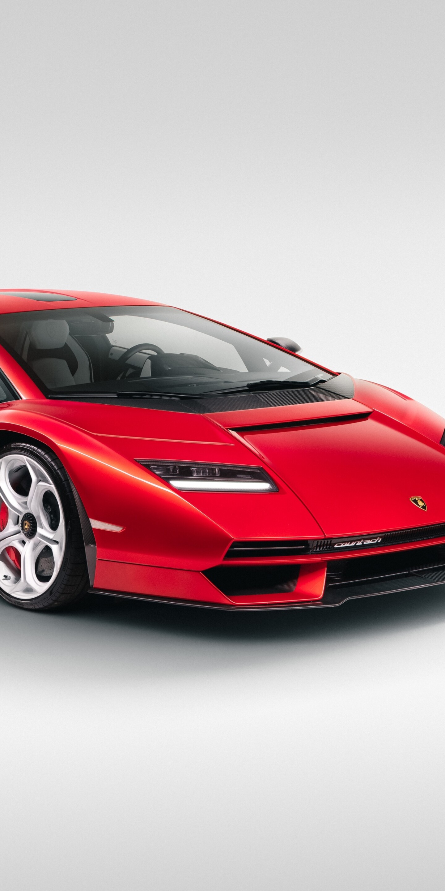A vibrant red Lamborghini Countach LPI 800-4 supercar isolated on a pure white background.
