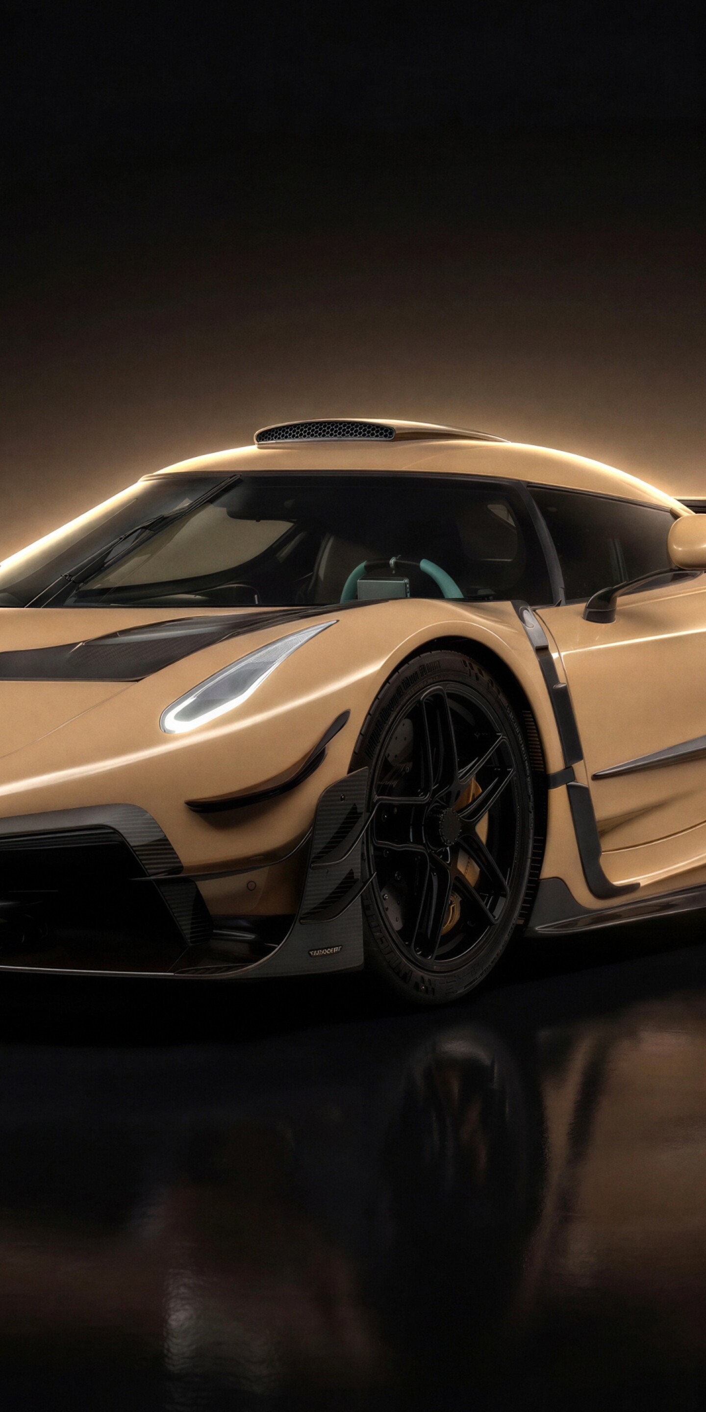 A dark, cinematic shot of a modified Koenigsegg Jesko with Mansory tuning and carbon fiber accents.