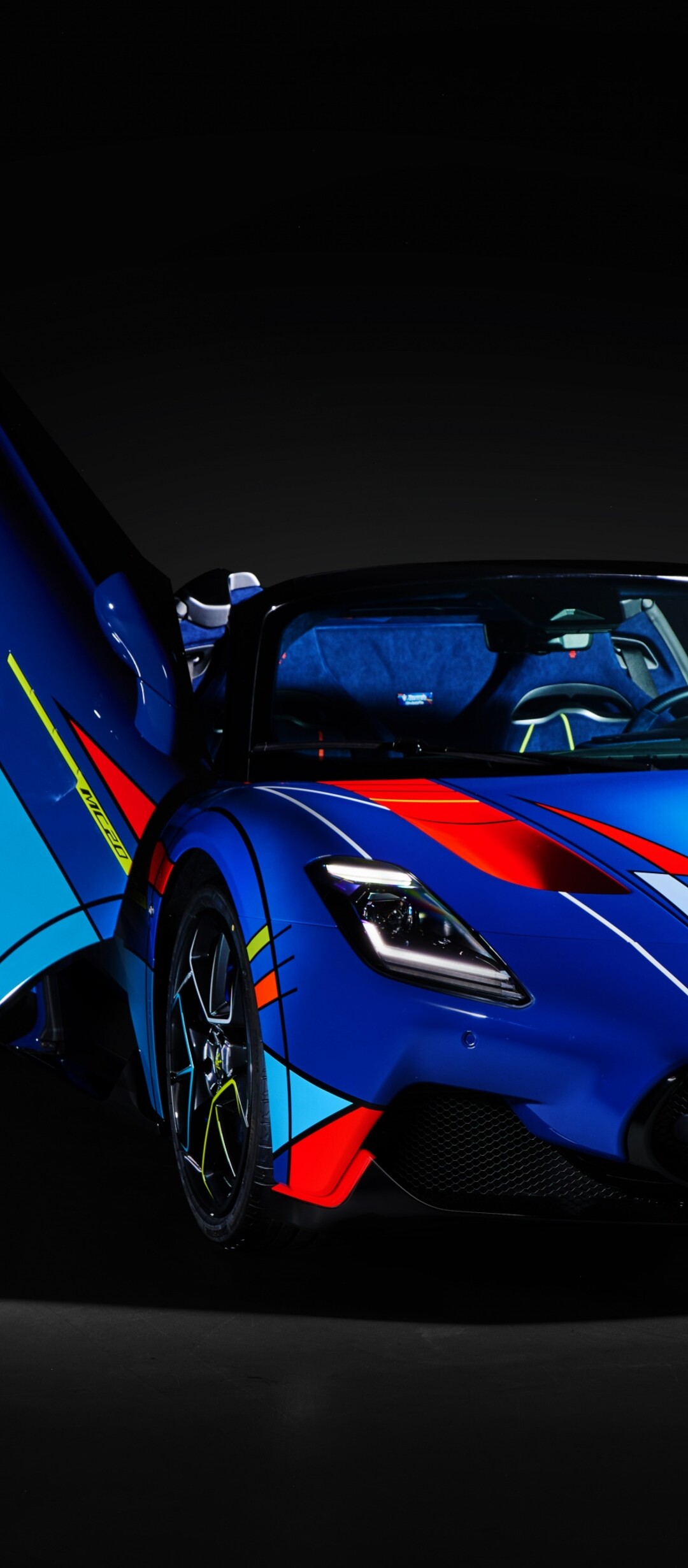A high-resolution, detailed view of a Maserati MC20 Cielo supercar set against a dark, atmospheric background.