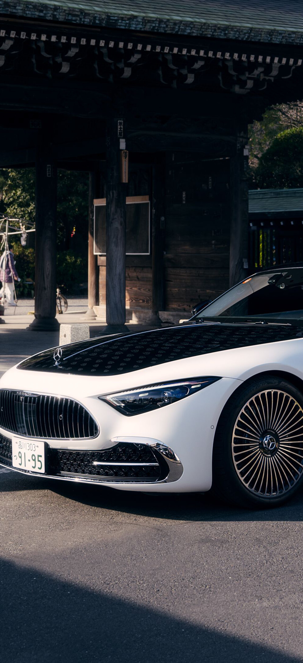 A luxurious Mercedes-Maybach SL 680 parked in a scenic outdoor environment, highlighting its premium finish and elegant design.