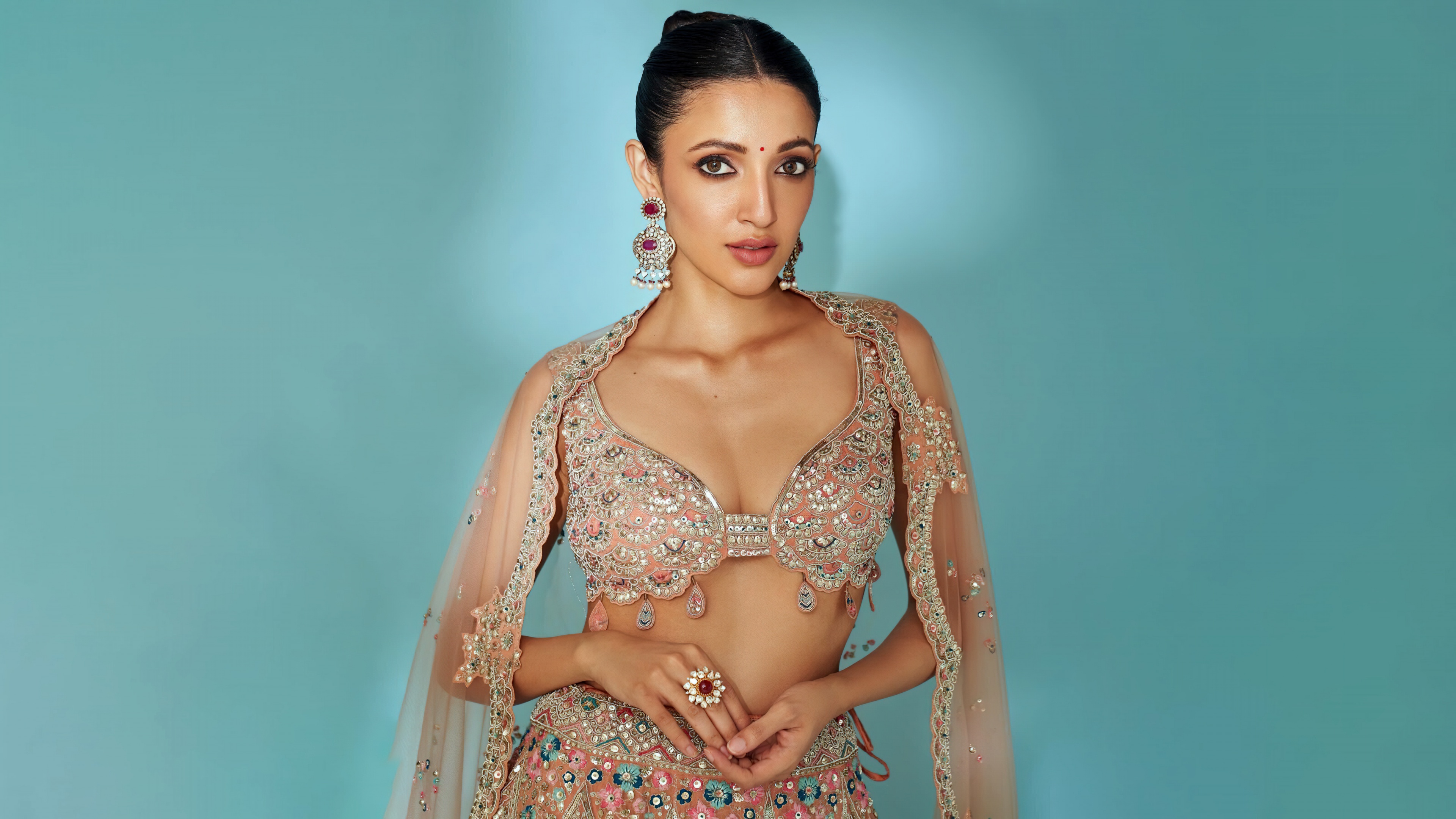 A stunning portrait of Indian actress Neha Shetty wearing elegant traditional Indian clothing.