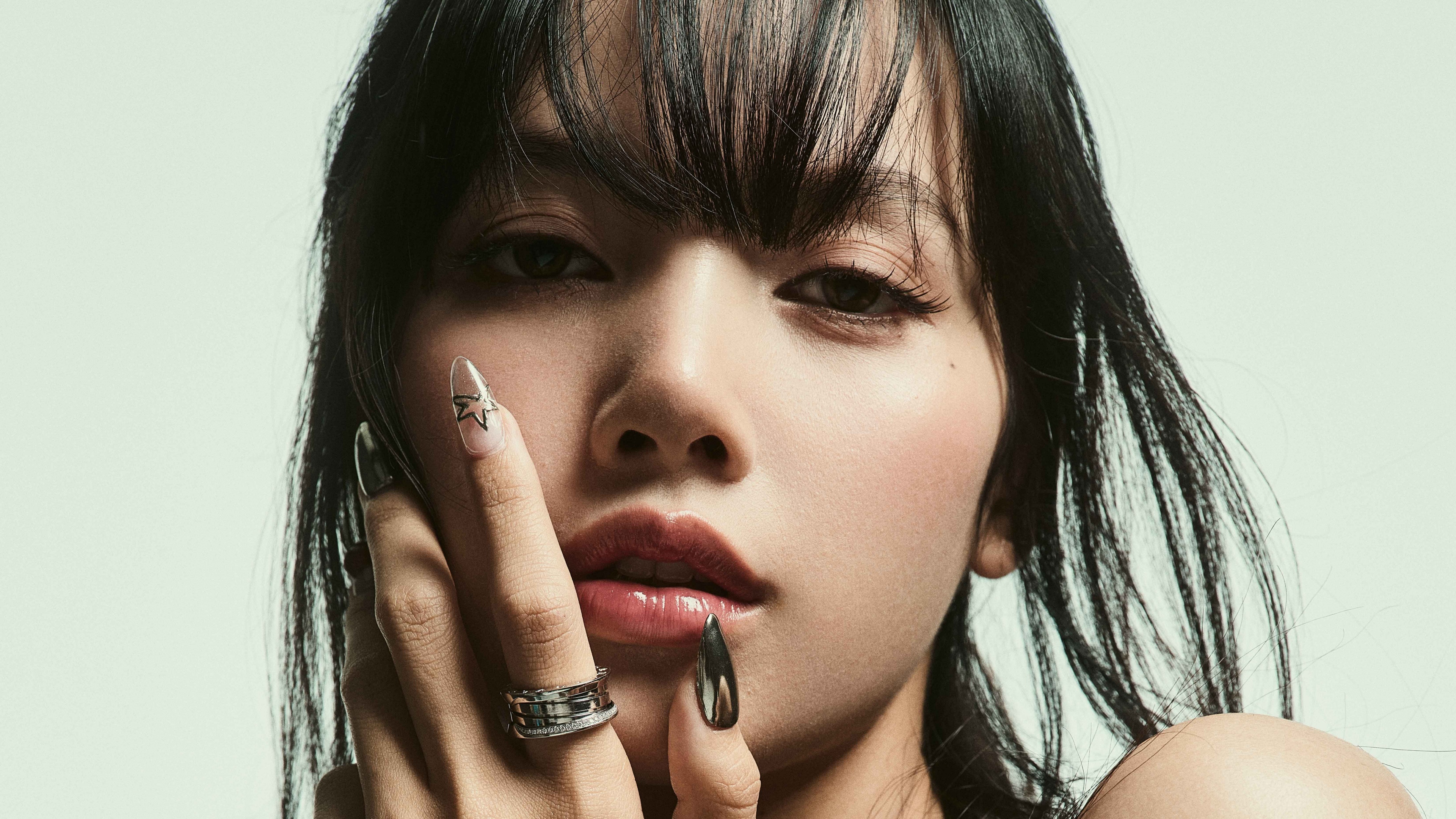 A high-resolution, vertical close-up portrait of Lisa from Blackpink