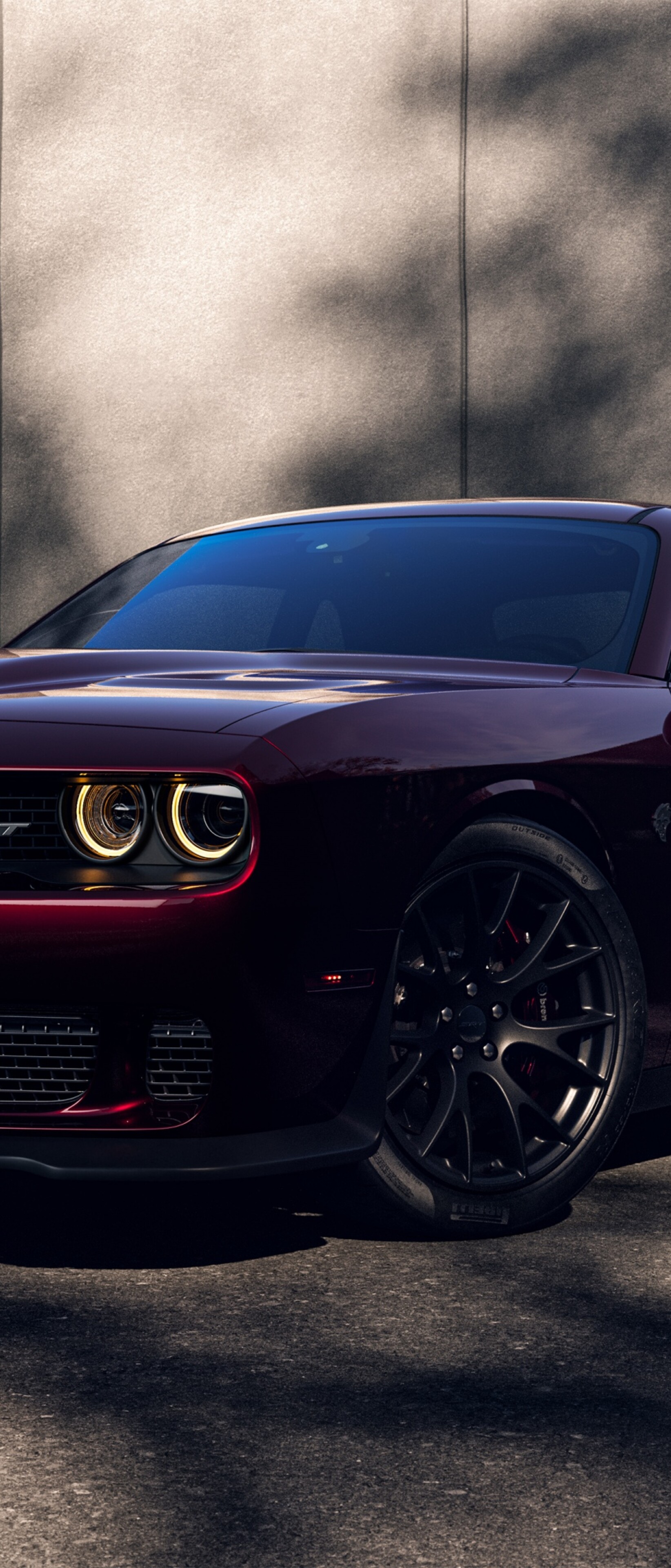 A high-resolution 5K shot of a bright red Dodge Challenger SRT Hellcat muscle car.