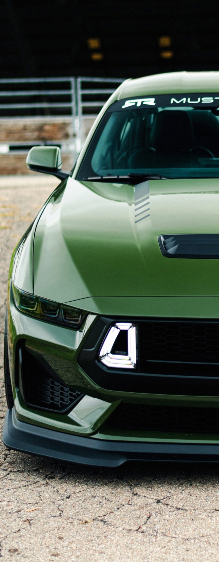 A high-resolution 5K close-up of a modern, aerodynamic performance sports car.