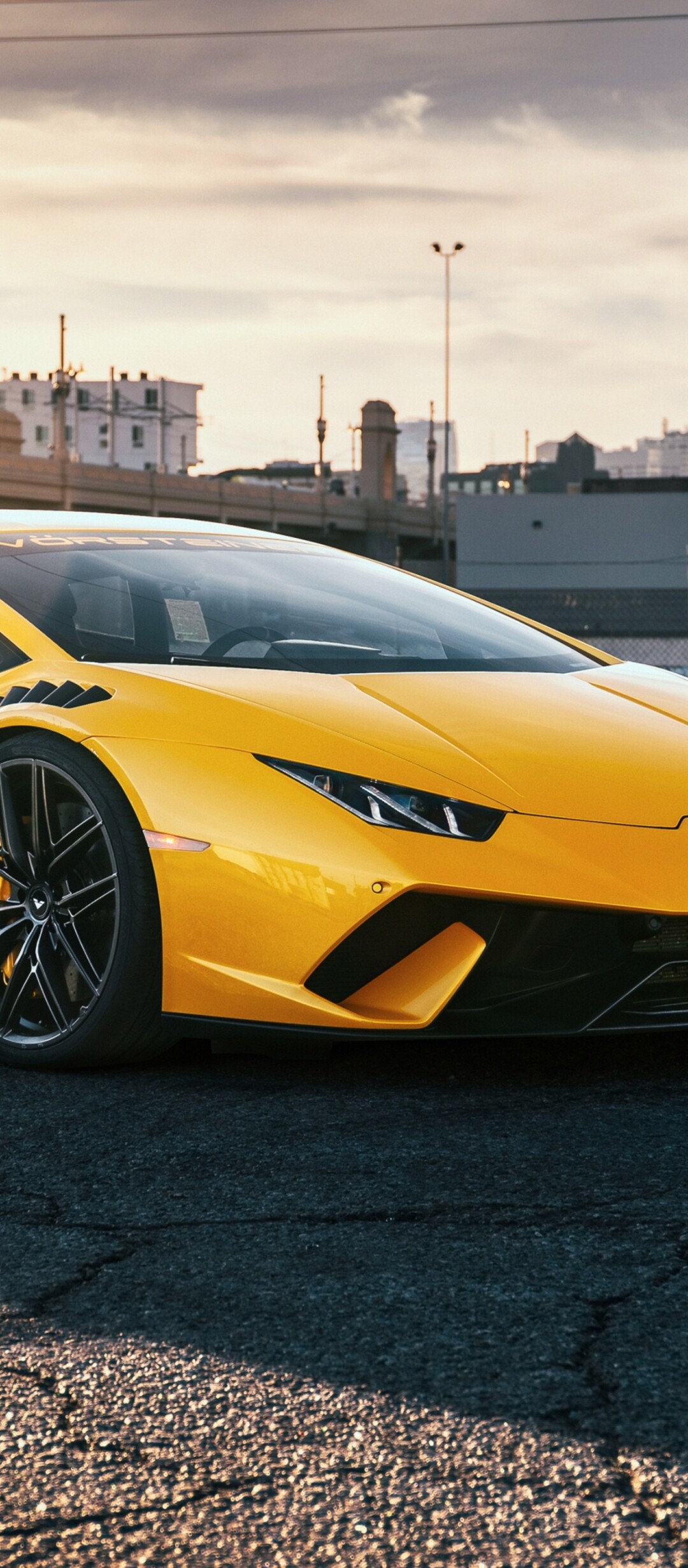 A collection of sleek, high-performance yellow sports cars parked together.