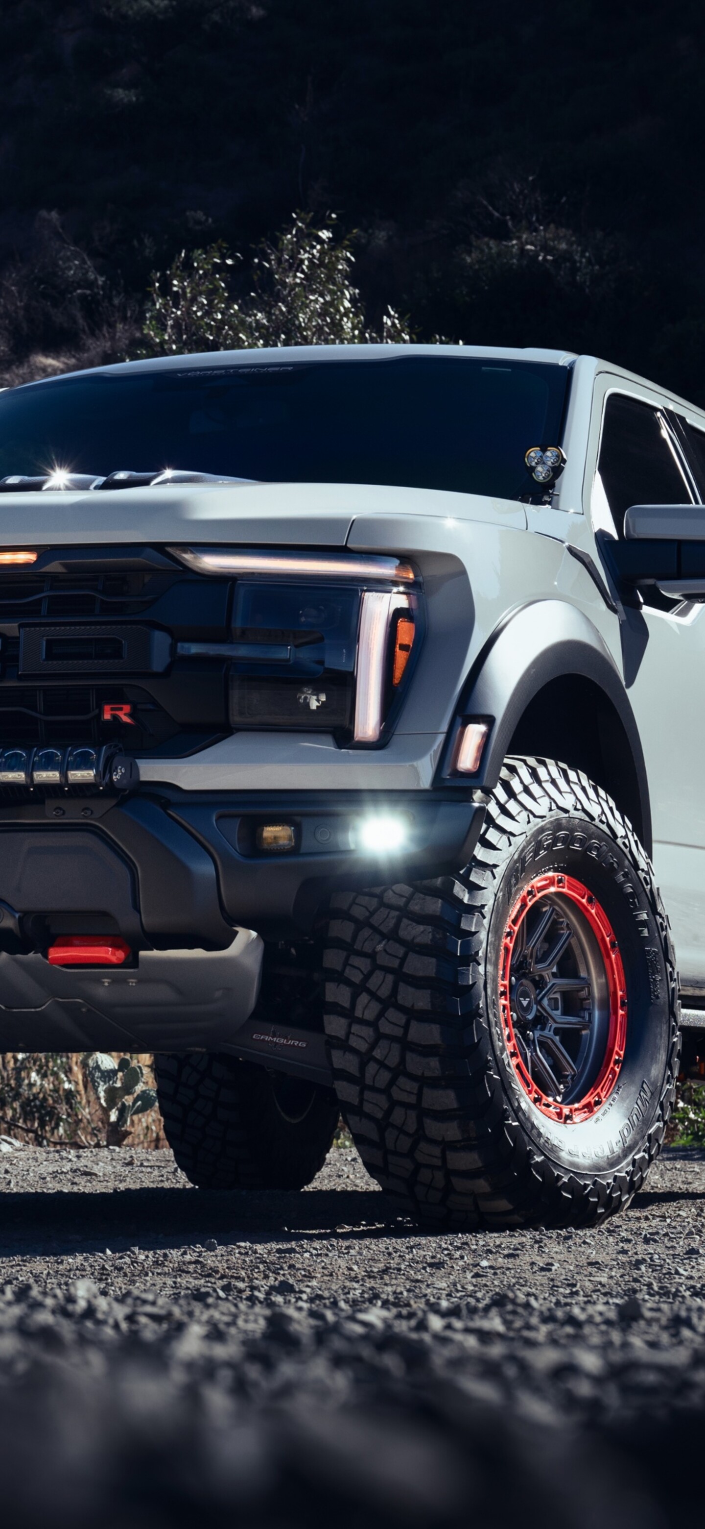 A high-detail, cinematic view of a modified Ford F-150 Raptor with Vorsteiner tuning and premium upgrades.