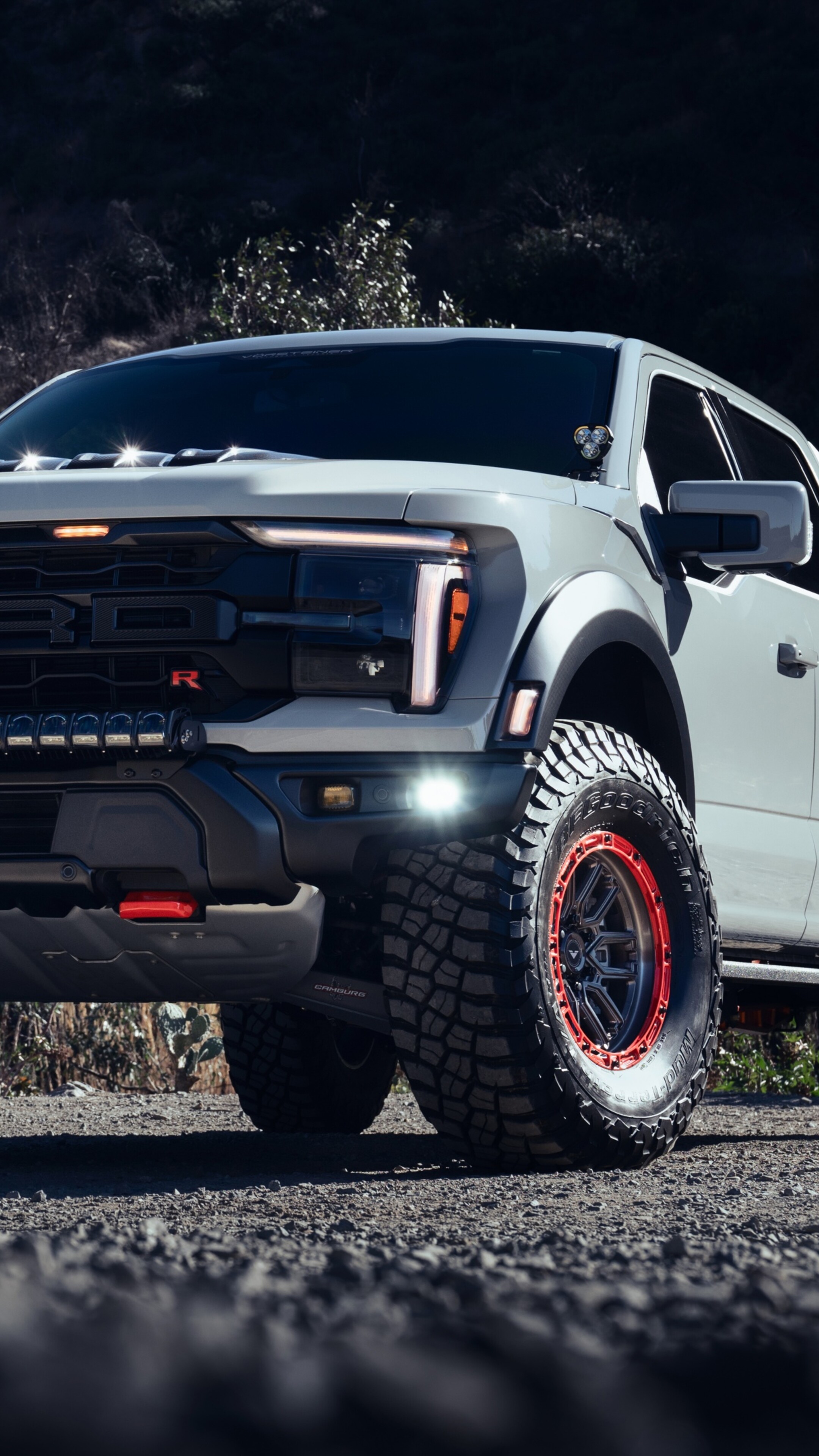 A high-detail, cinematic view of a modified Ford F-150 Raptor with Vorsteiner tuning and premium upgrades.
