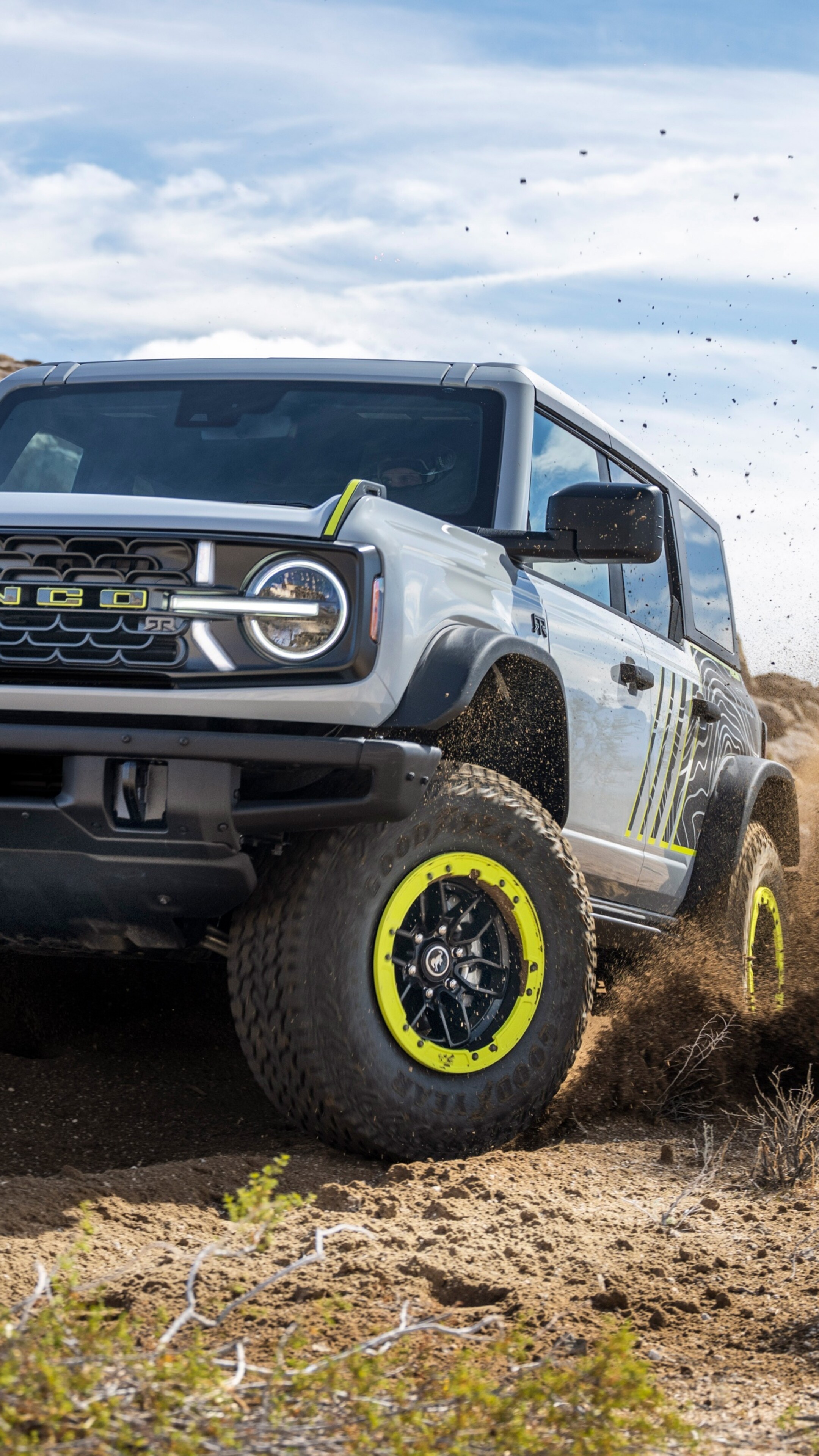 A sleek and rugged futuristic off-road SUV designed for 2027, featuring advanced all-terrain capabilities.