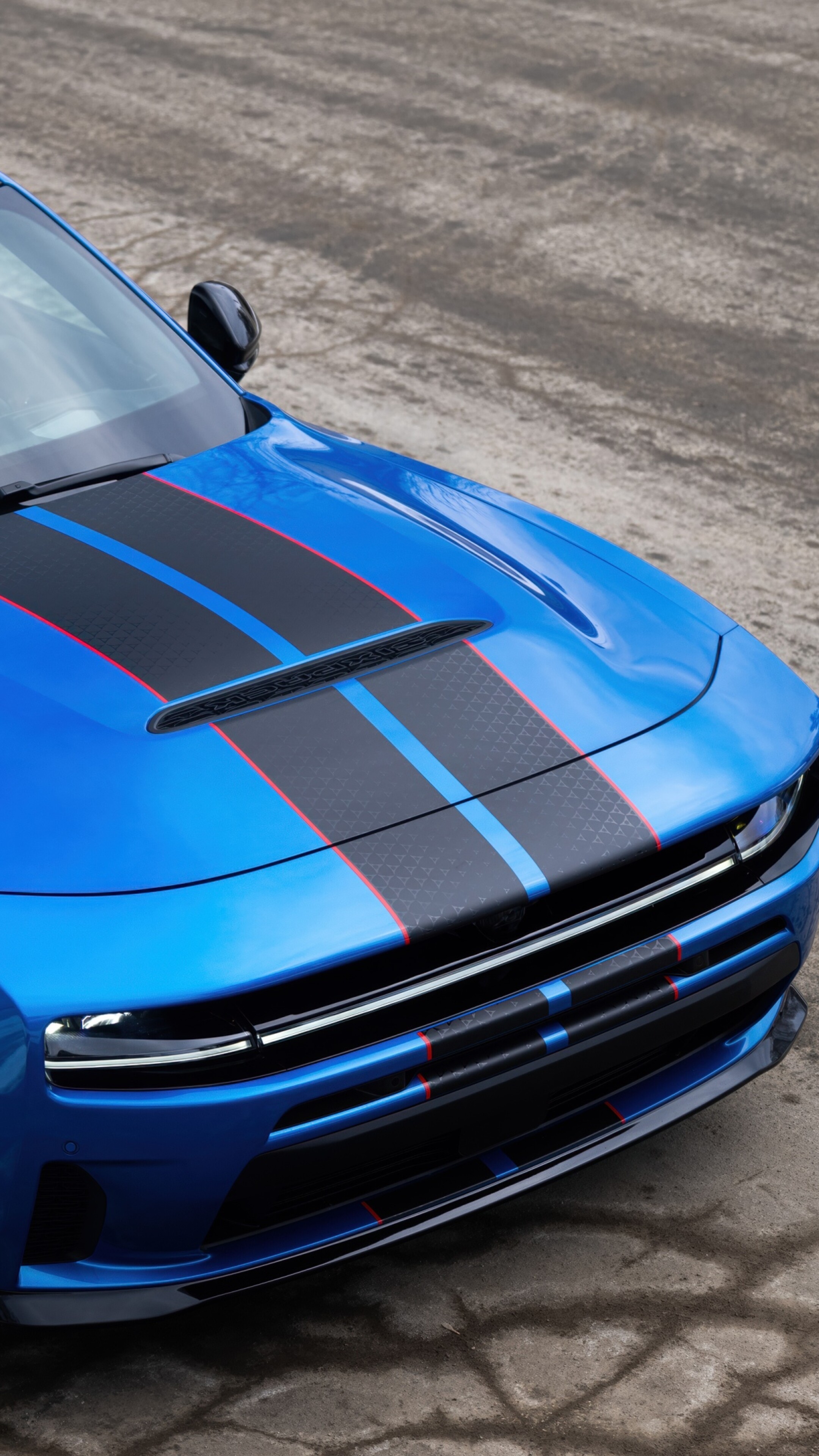 A sleek and aerodynamic blue concept car featuring futuristic 2026 design elements.