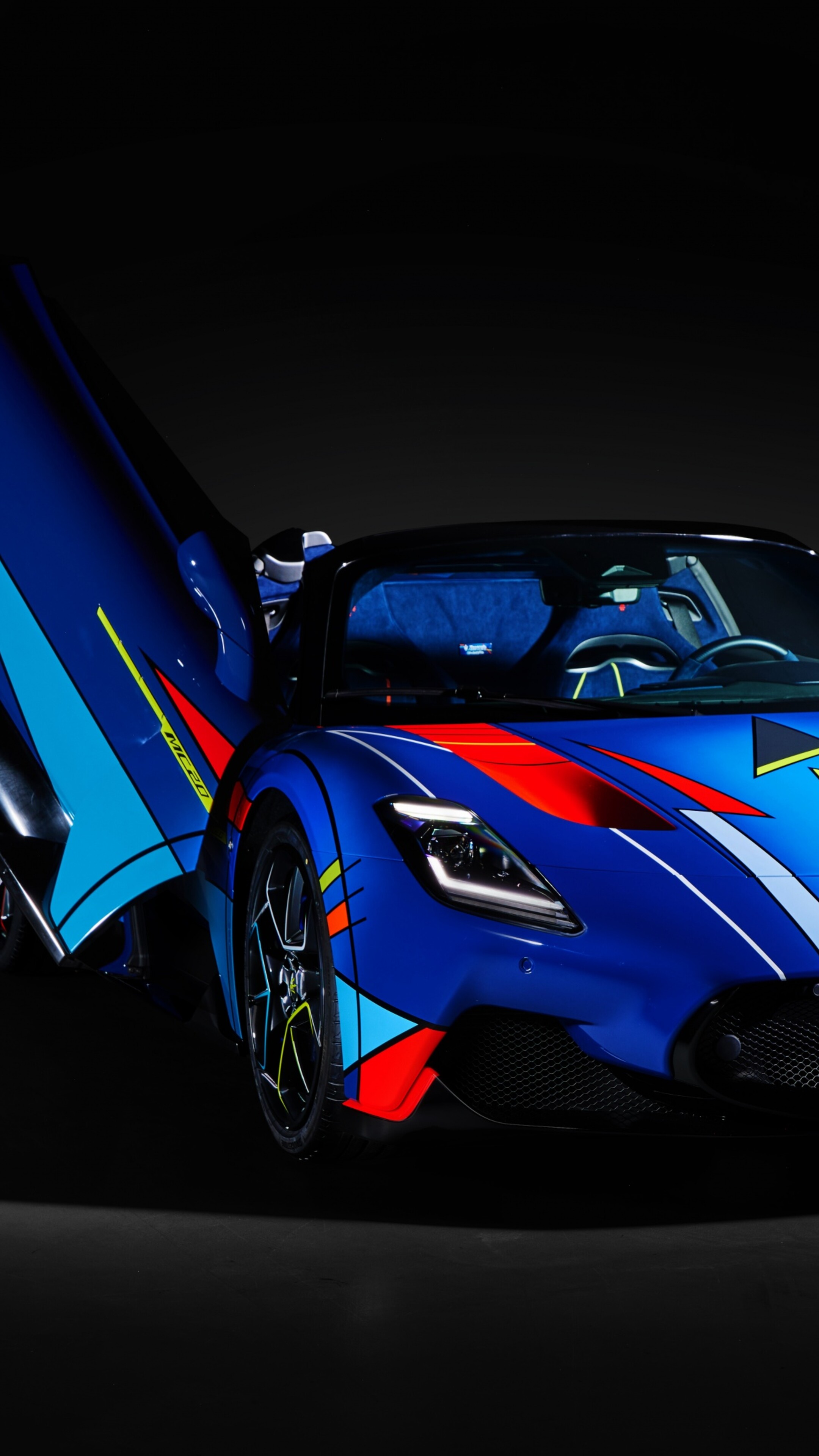A high-resolution, detailed view of a Maserati MC20 Cielo supercar set against a dark, atmospheric background.